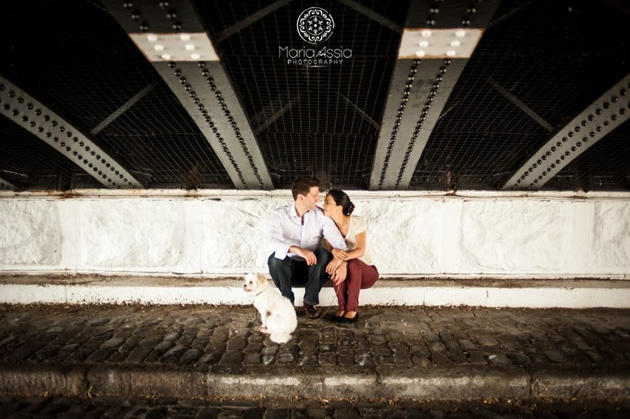 Elopement couple sit under a Regent's Canal Bridge with their little dog