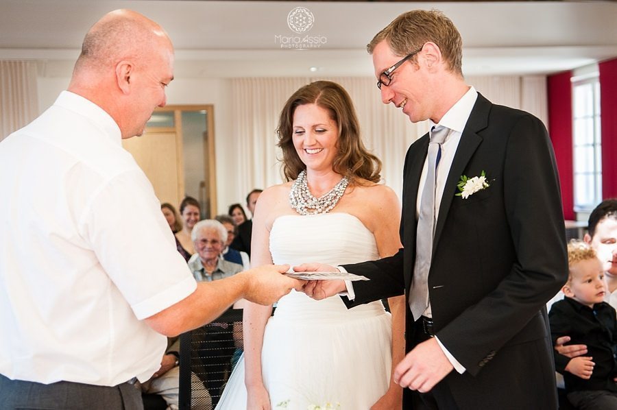 Registrar handing the bride and groom their wedding certificate at a Bavarian civil ceremony