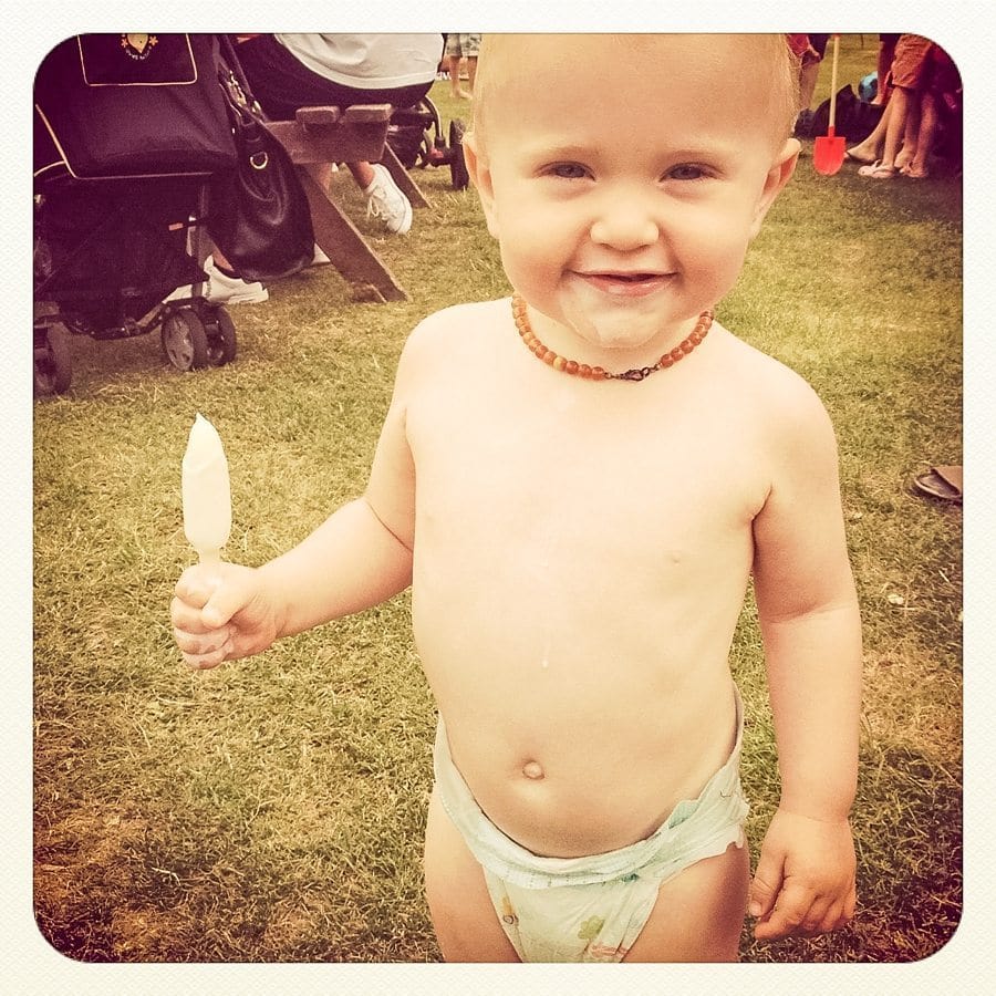 toddler eating ice cream at summertime