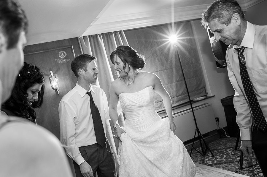 bride and groom dancing at their Billesley Manor Hotel Fuchsia Spring Wedding