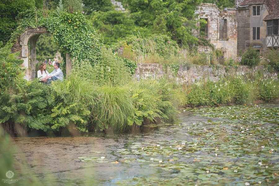 Couple sitting in ruined doorway at Scotney Castle