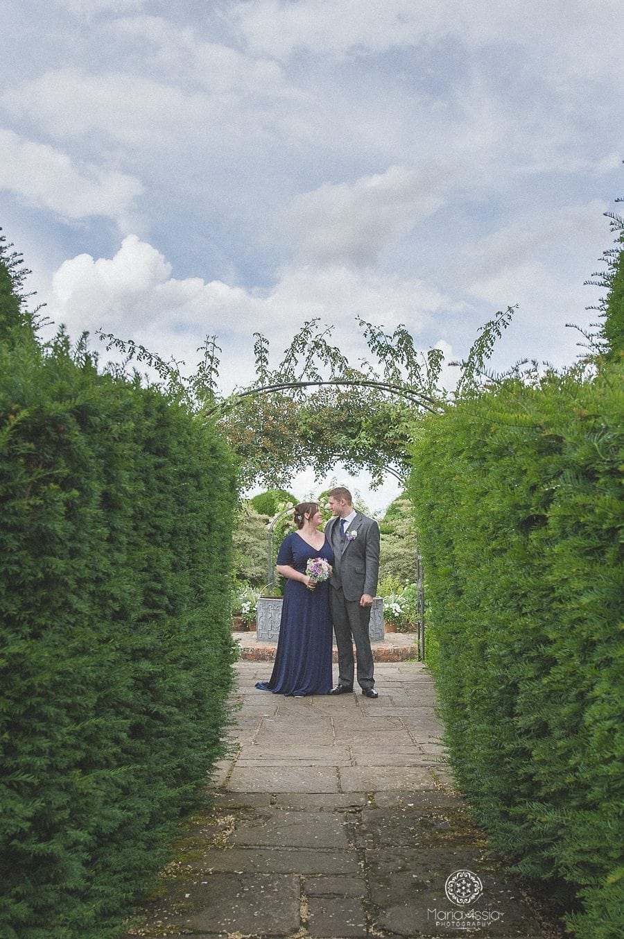 Bride and Groom at the topiary garden at Birtsmorton Court