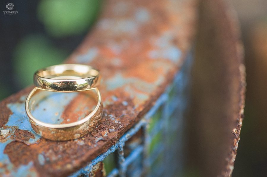 Wedding rings on a rustic box at a Birtsmorton Court Navy Blue Wedding - Maria Assia Photography