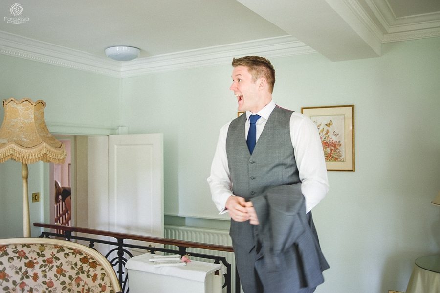 Groom's reaction to the bride at their Birtsmorton Court Navy Blue Wedding - Maria Assia Photography