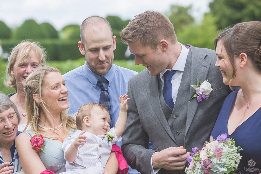 Wedding guests chatting with the bride and groom at Birtsmorton Court