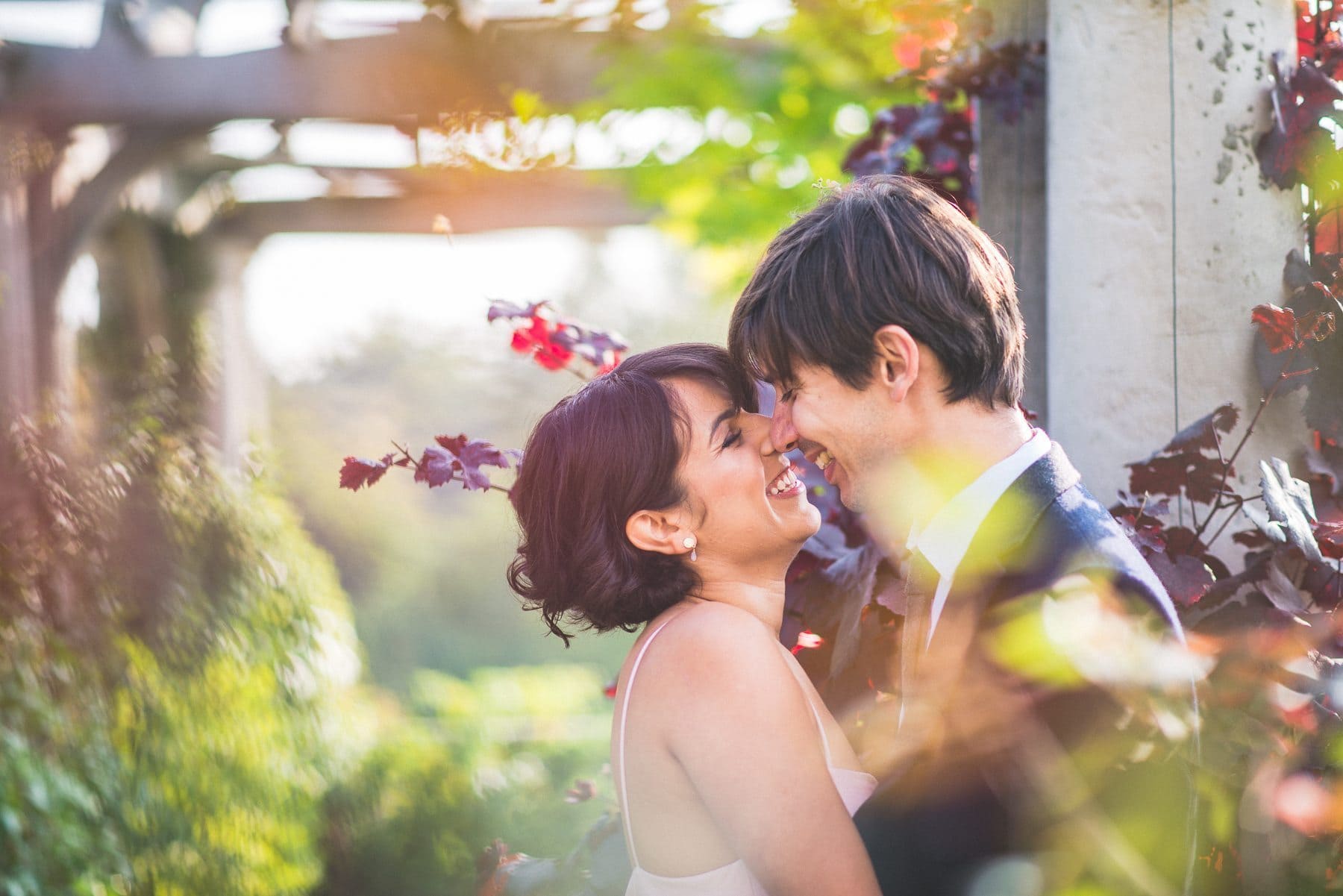 couple laugh together hugging at their Hampstead Hill Prewedding Shoot | Maria Assia Photography