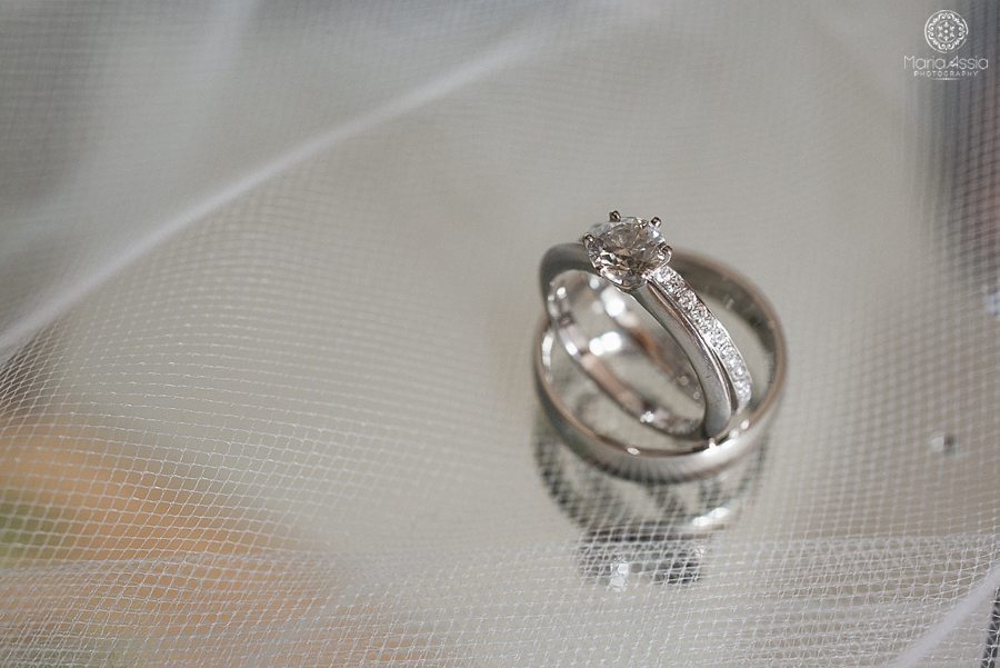 Wedding rings sitting on a wedding veil at Coworth Park Wildflower Meadow Wedding