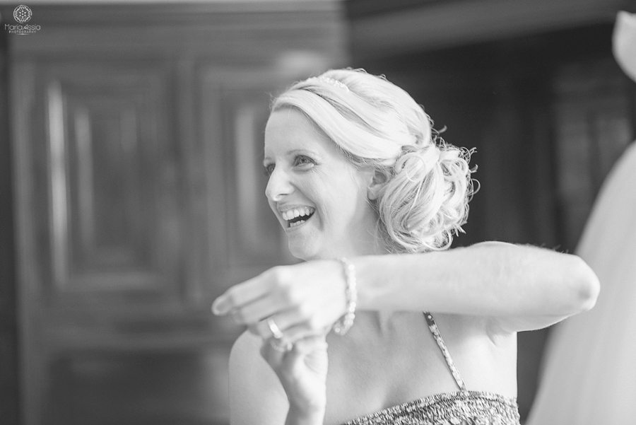 Bride putting on her wedding gift bracelet