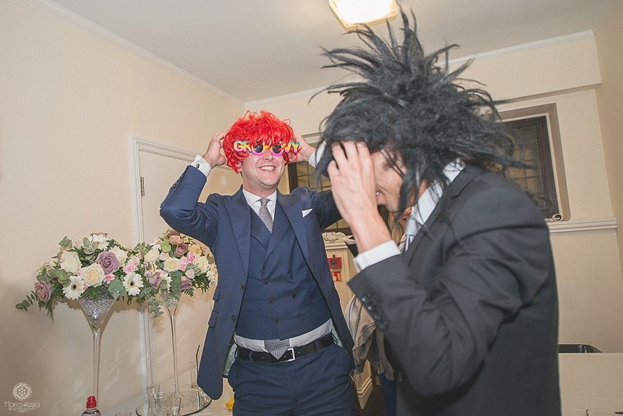 Wedding guests wearing funny wigs