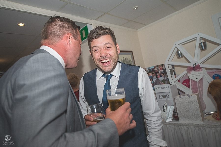 Wedding guests laughing and chatting