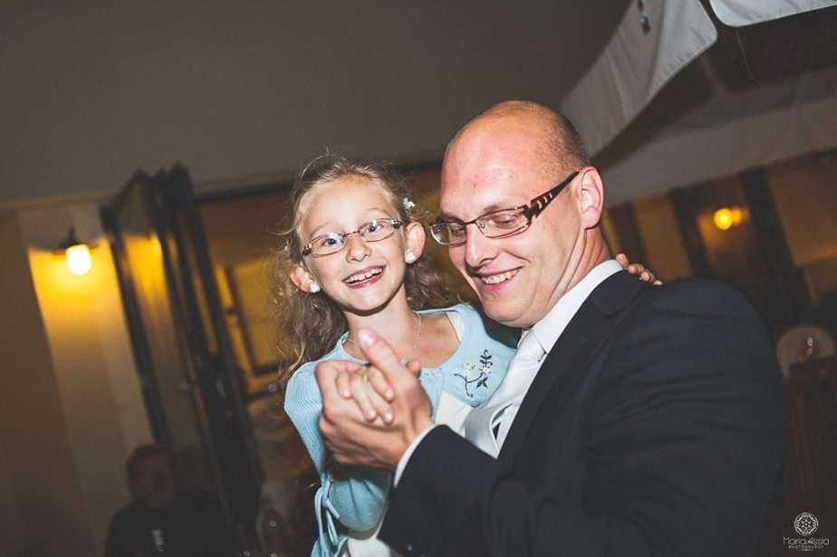 Groom and his niece dancing and laughing.jpg