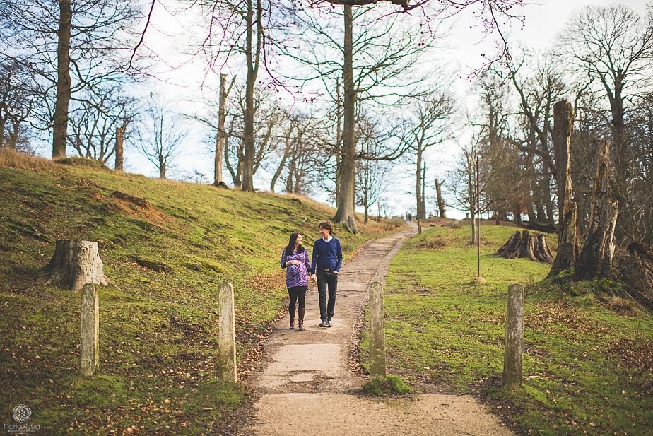 Pregnant girl and her husband walking in the park at Knole Park in Sevenoaks