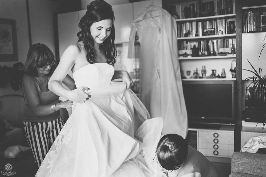 friends tidying a bride's dress.jpg