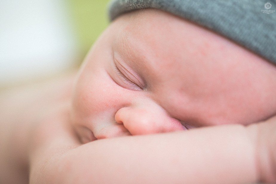 Family photographer in Sevenoaks newborn shoot baby sleeping closed eyes