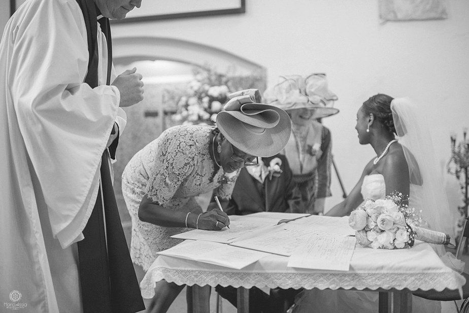 colourful ethnic Wedding witnesses signing the wedding register