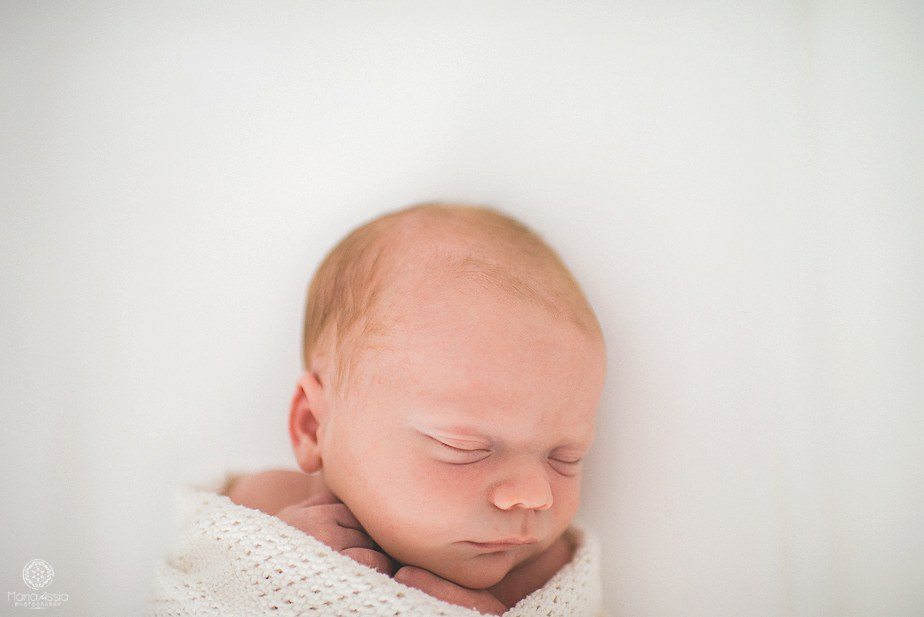 a swaddled little baby at a newborn shoot