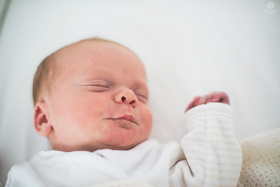 newborn baby pursing his lips at his Sevenoaks Newborn Shoot