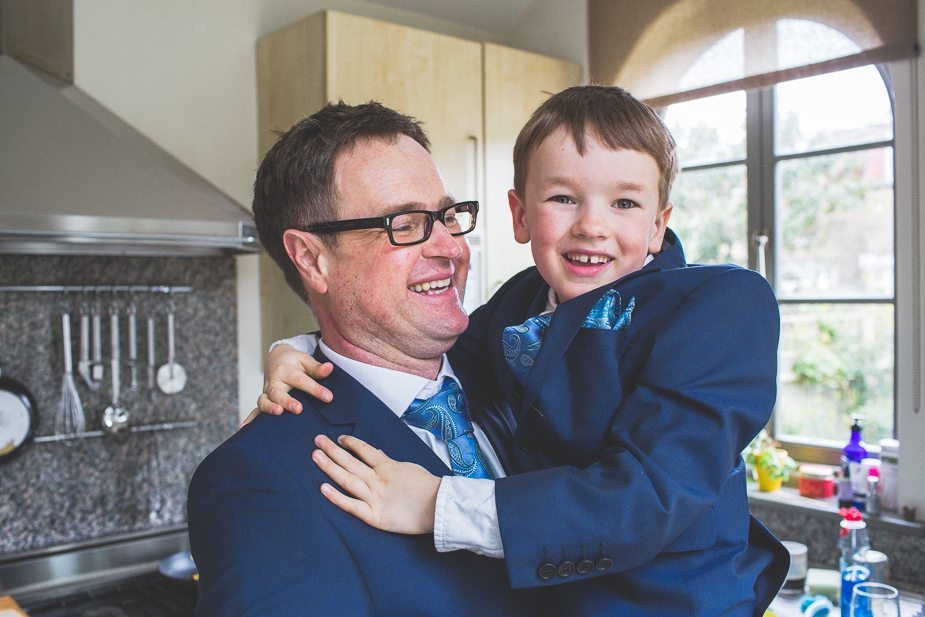 The groom holding his little son