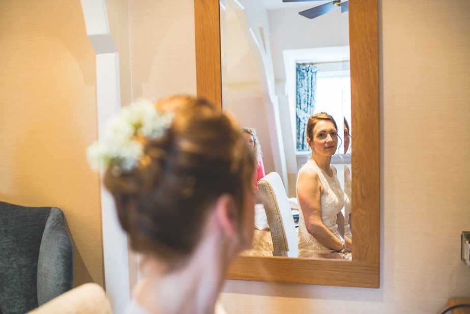 A bride looking at herself in the mirror