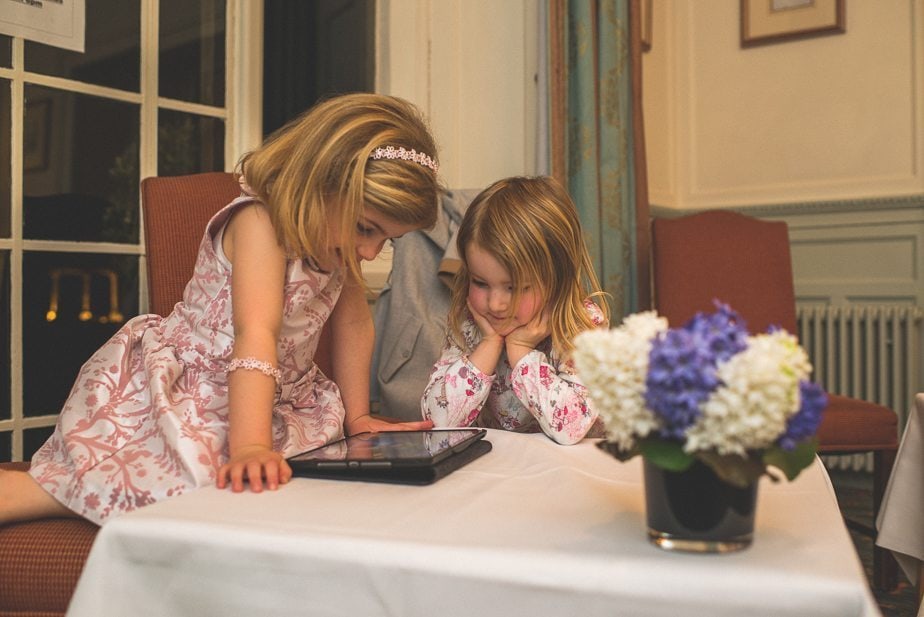 Two little girls playing on the ipad at Warren house