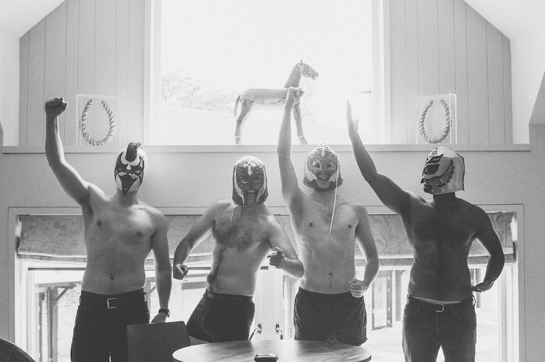 Groom and groomsmen wearing boxershorts and Mexican wrestling masks