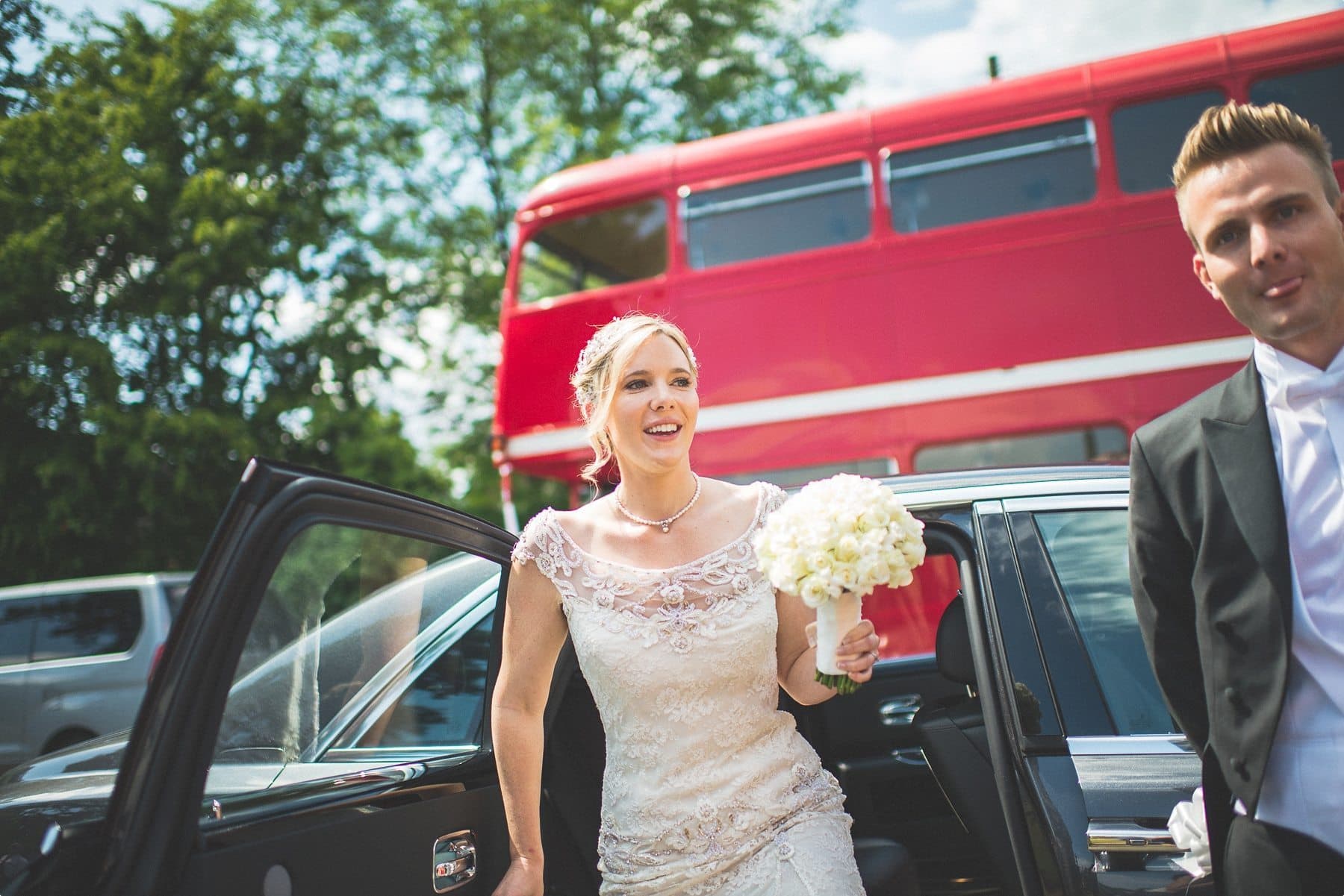 Coworth Park Bride getting out of her wedding car at St Michael and all Angels church