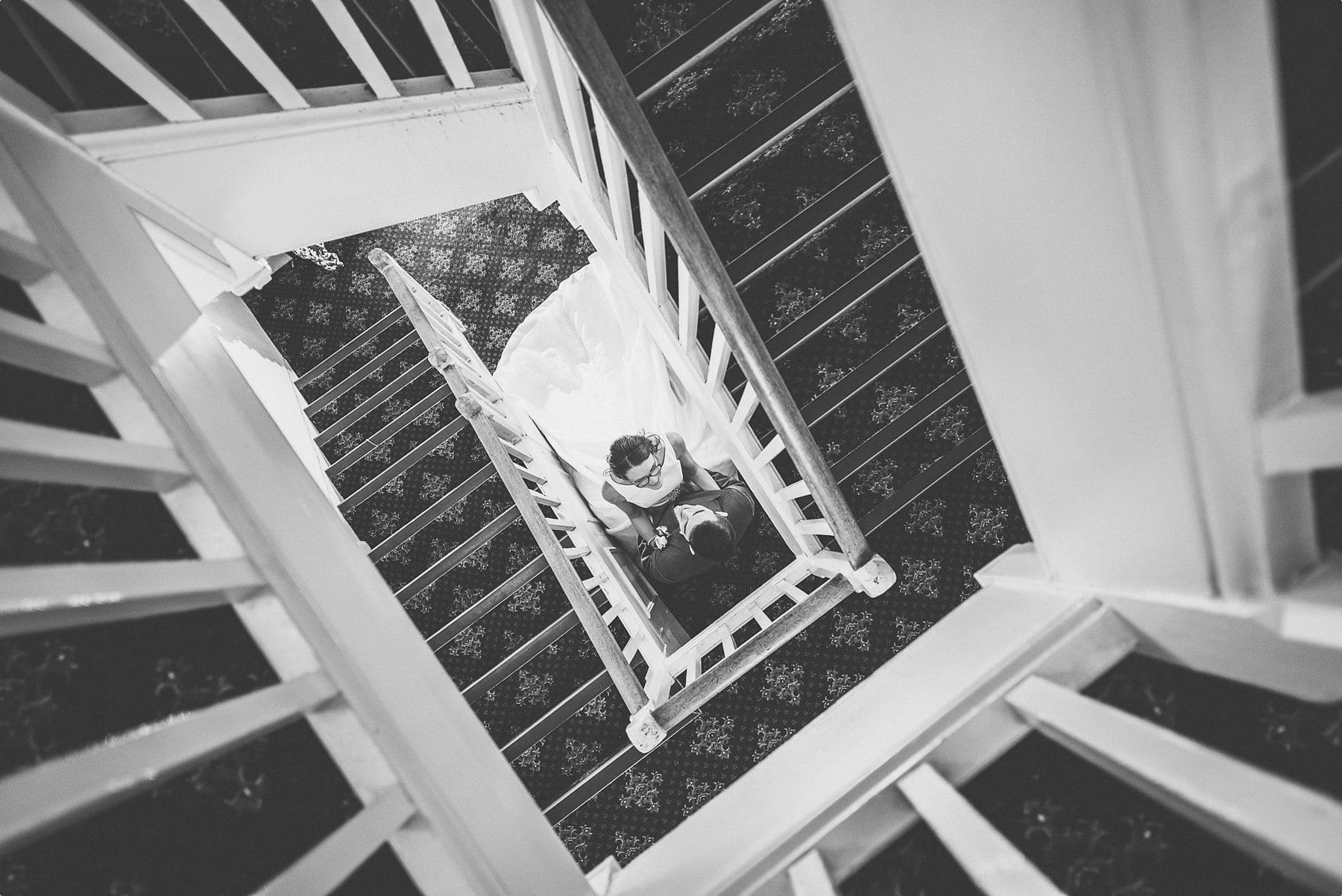 Bride and groom at Horsley Towers staircase