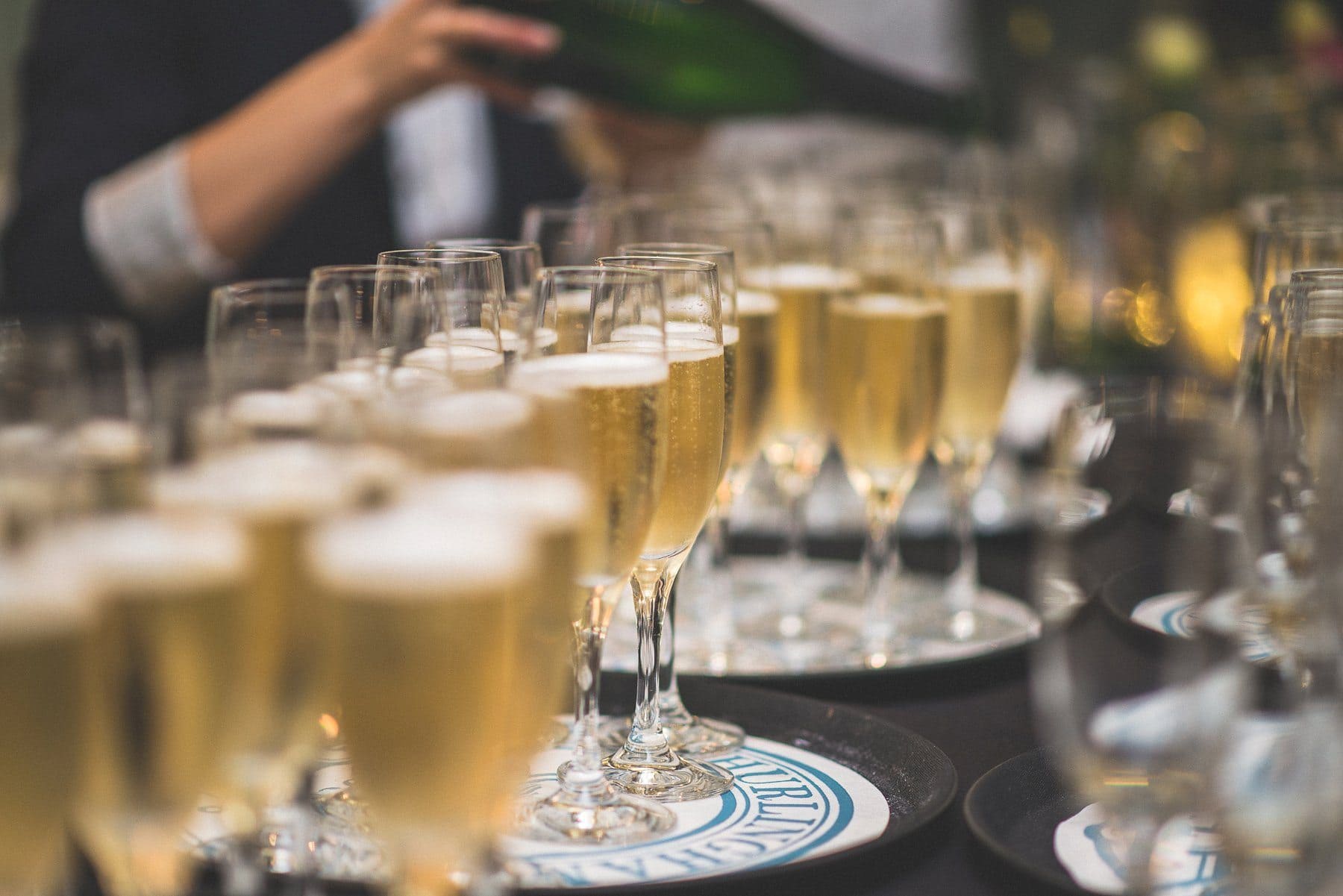 The Hurlingham Club wedding staff filling champagne flutes