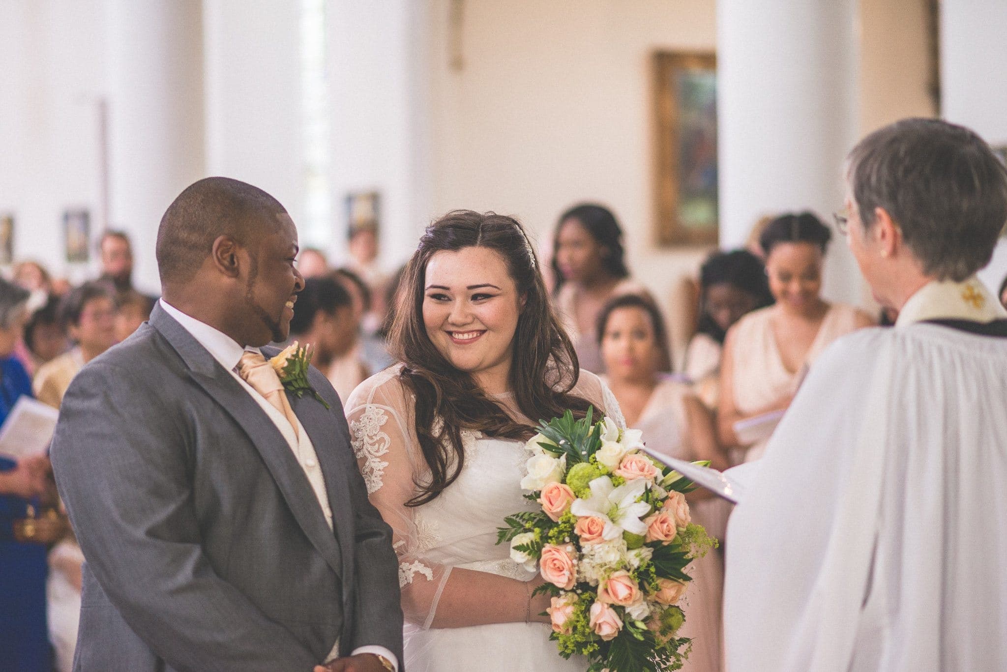 Bride and Groom smile at each other at their wedding ceremony