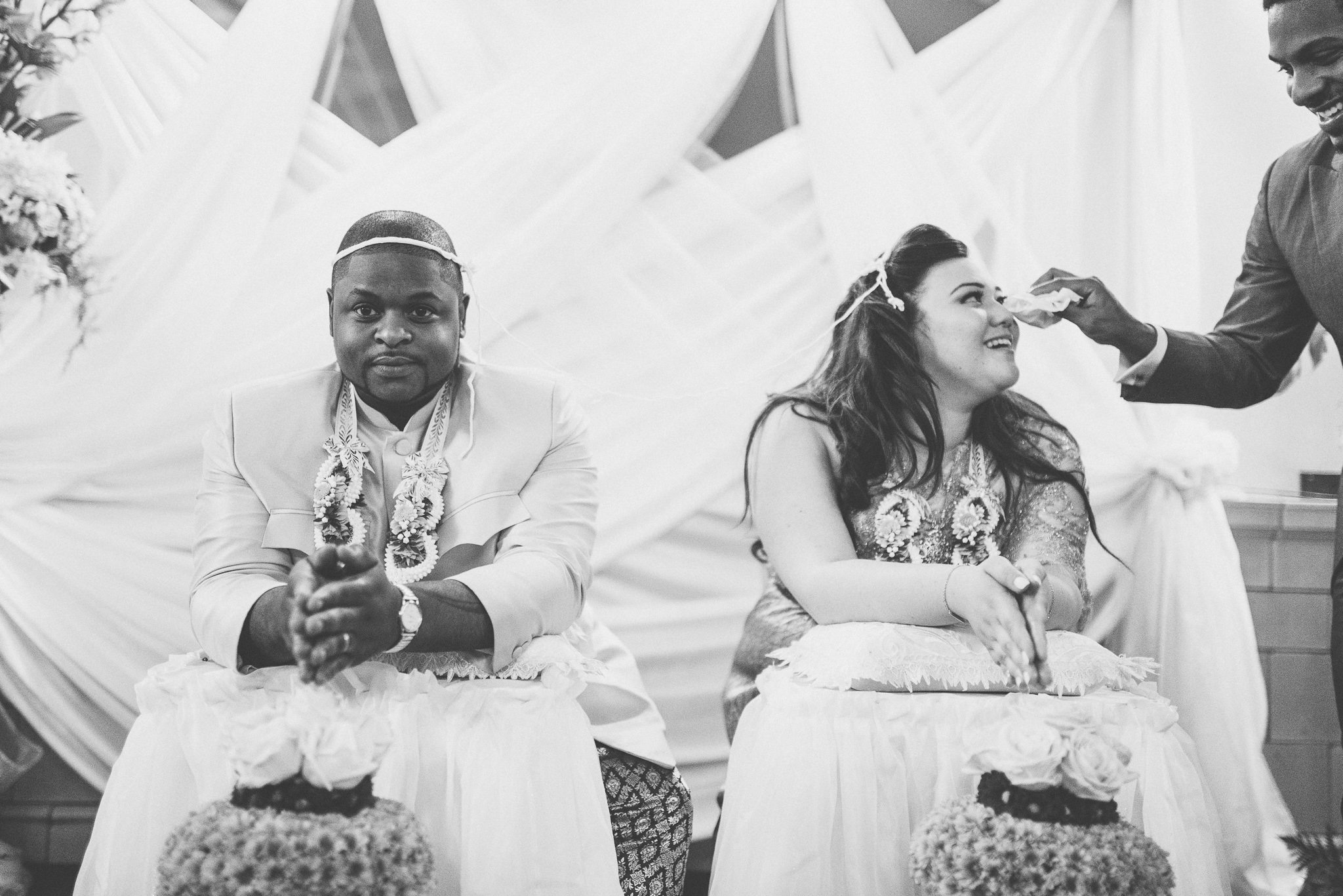 brides brother wiping away her tears during her Thai water blessing ceremony