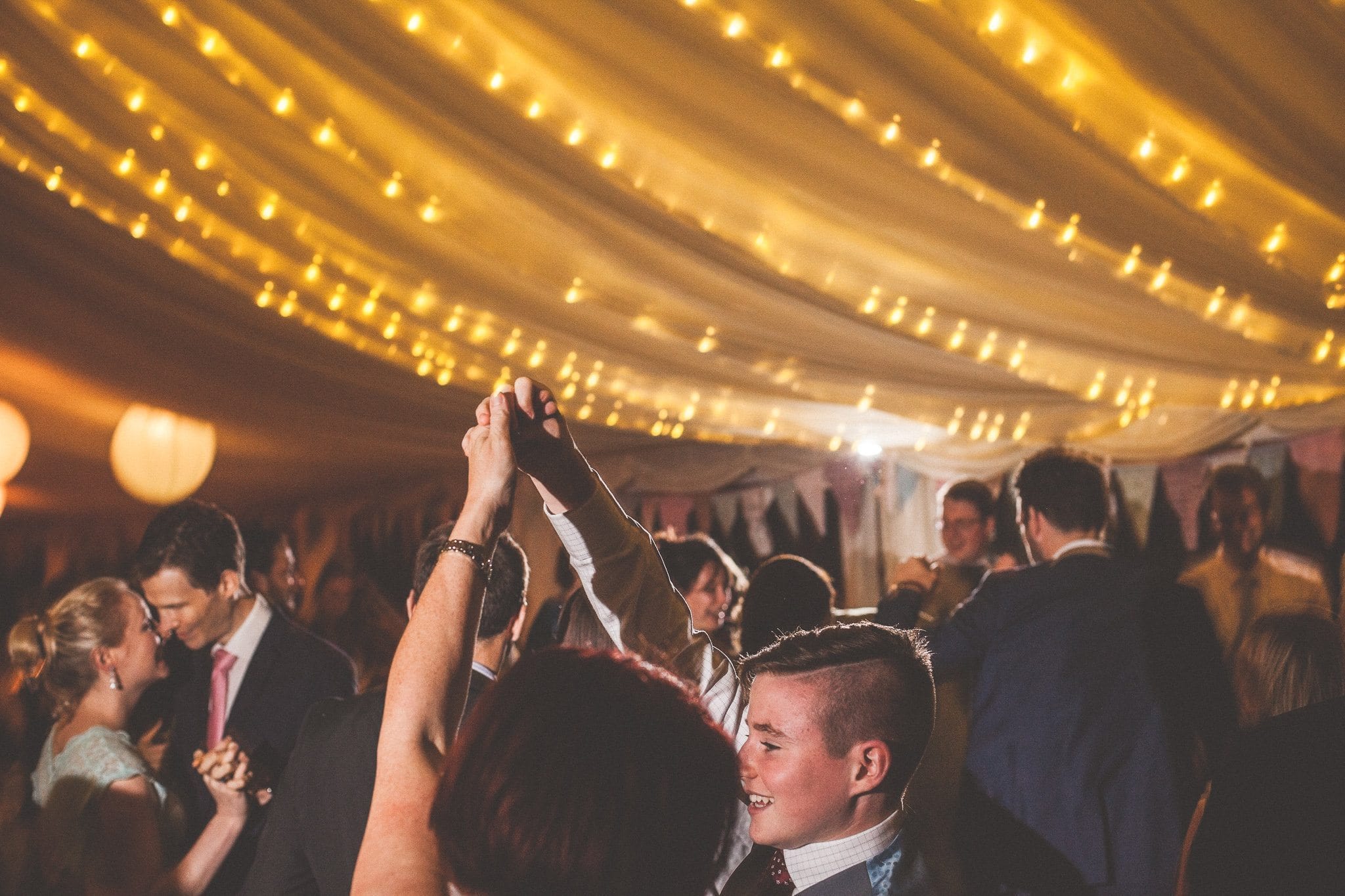 The party gets going in the lit marquee at a Smedmore House Wedding