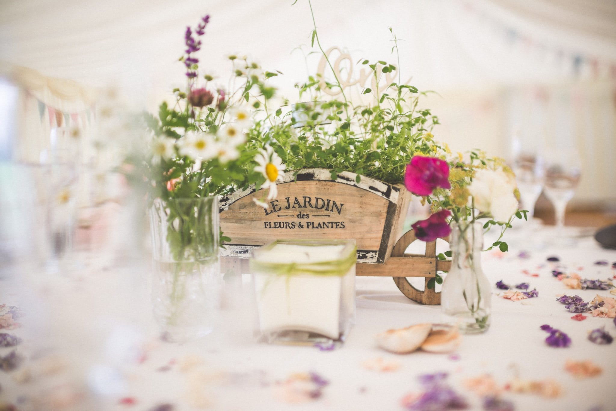 Rustic floral centrepieces in the marquee at a Smedmore House Wedding