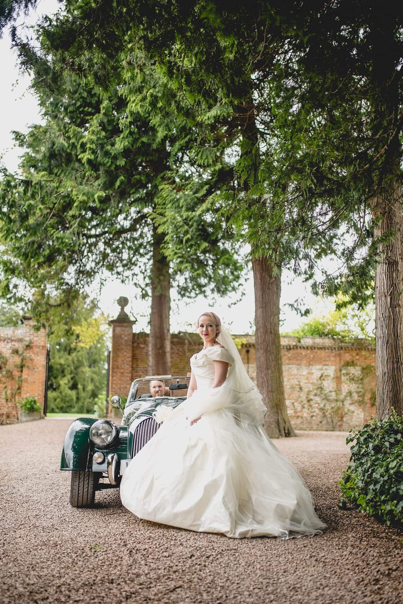 Regal wedding portrait of the bride and groom at their Quirky Birtsmorton Court Wedding