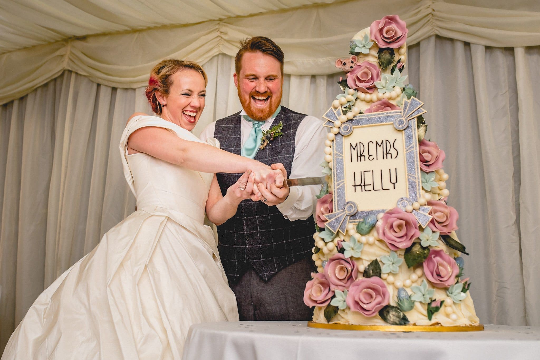 Hatty and Steven cut their epic wedding cake