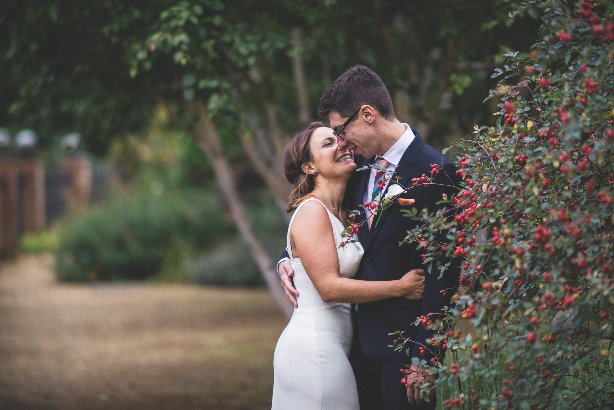 Bride and groom laughing at their Hampstead Pergola Wedding