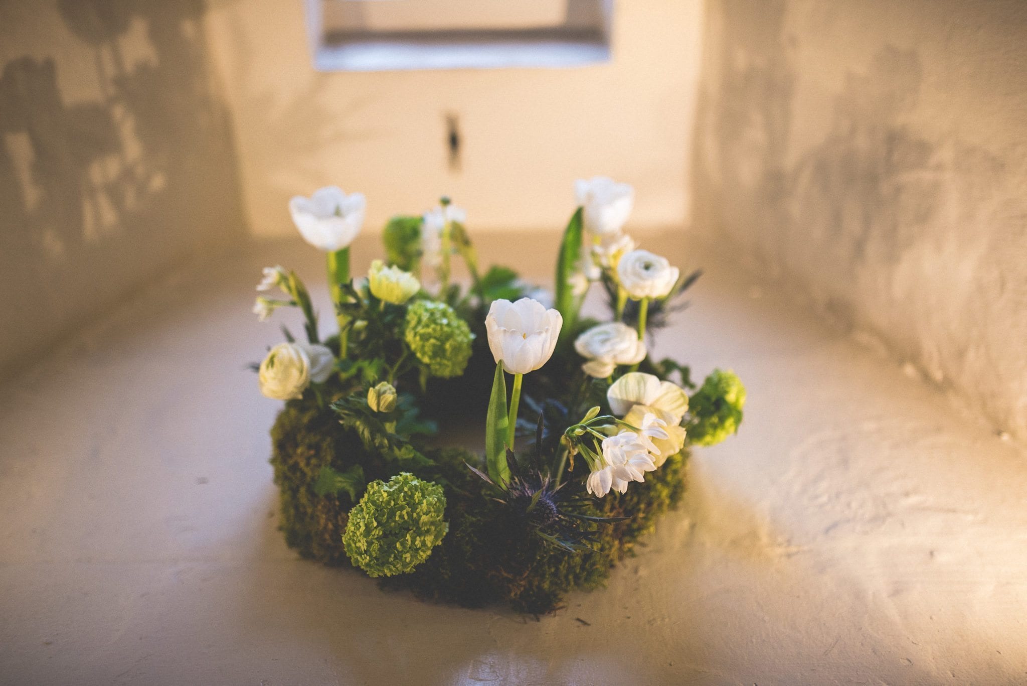 Spring floral ring arrangement at a Farnham Castle Wedding Lantern Hall