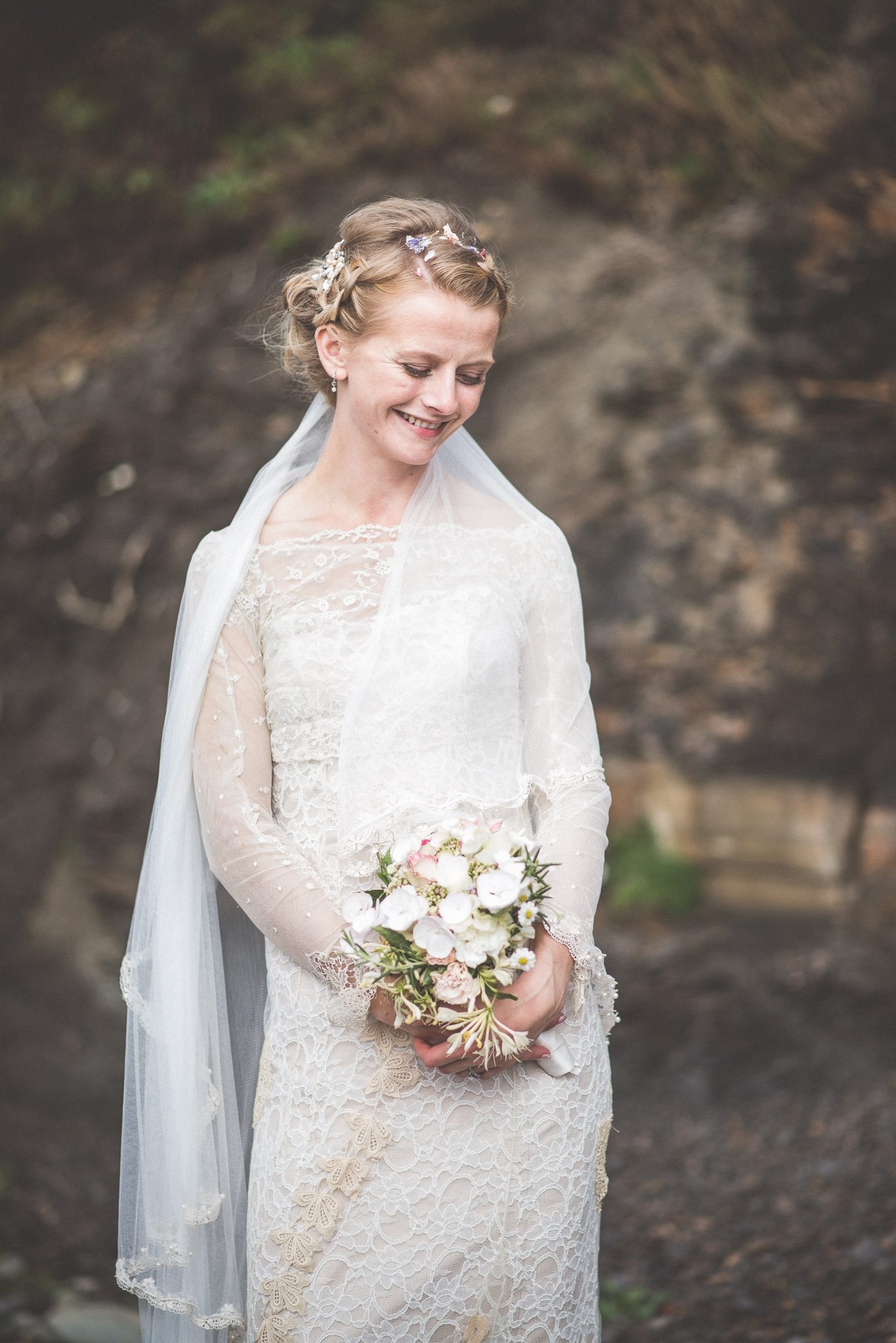 Smedmore House bride smiling happily in her handmade dress in Kimmeridge Bay