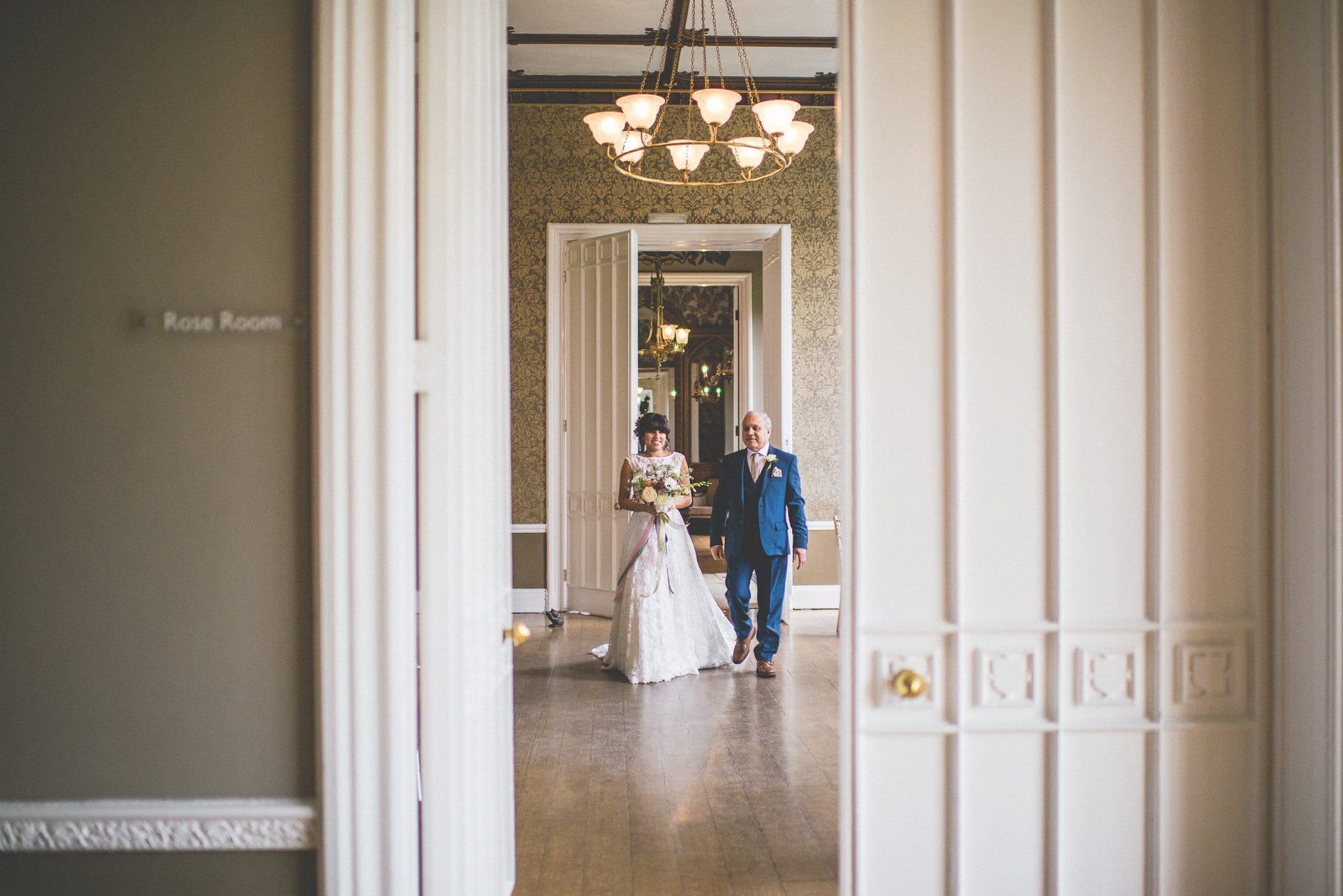 Bride and her dad crosses to enter the Nonsuch Mansion ceremony room