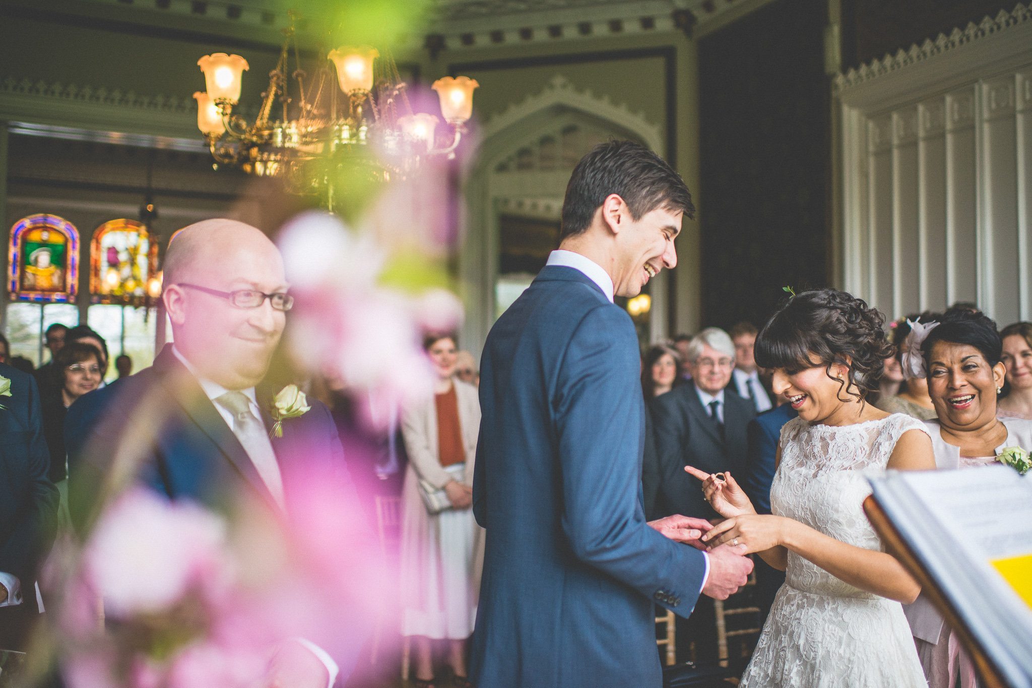 The bride and groom laugh at their Nonsuch Mansion wedding ceremony