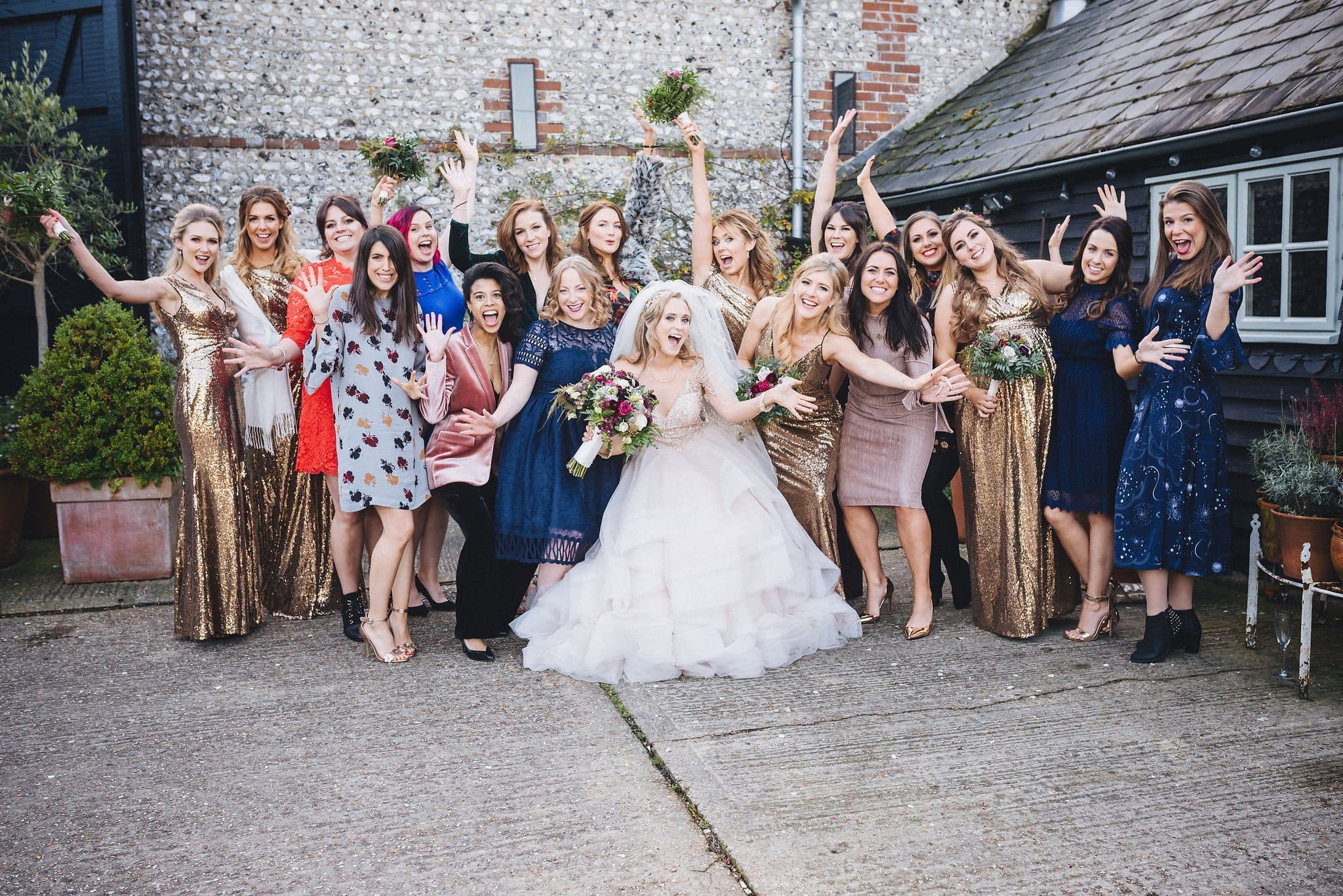 Bride laughing with her girlfriends at Upwaltham Barns