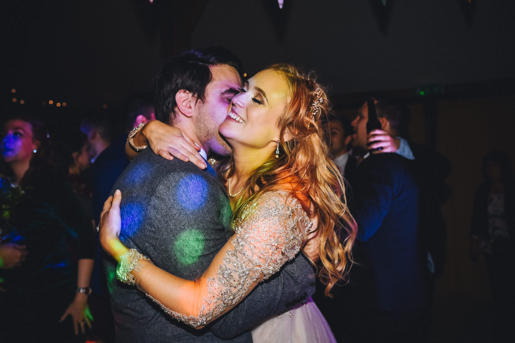 Bride and groom hugging after their first dance at Upwaltham Barns