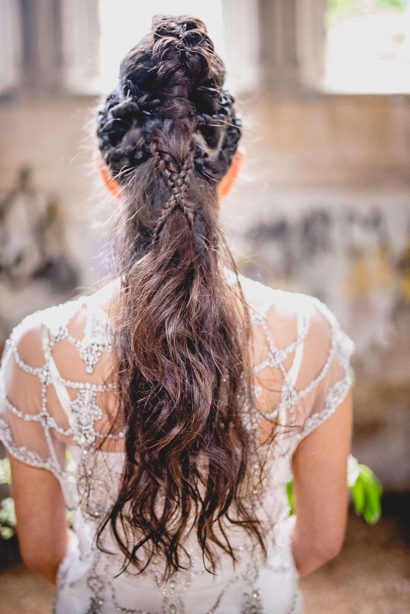 A shot from behind showing the amazing braided mohican hairstyle on our bridal model Rebecca