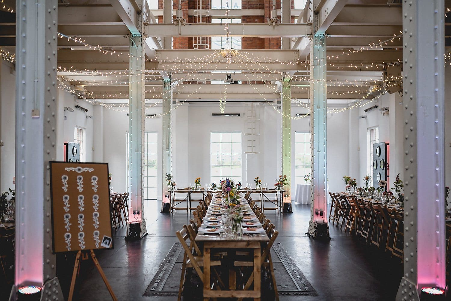 Internal shot of West Reservoir Centre with trestle tables and festoon fairy lights