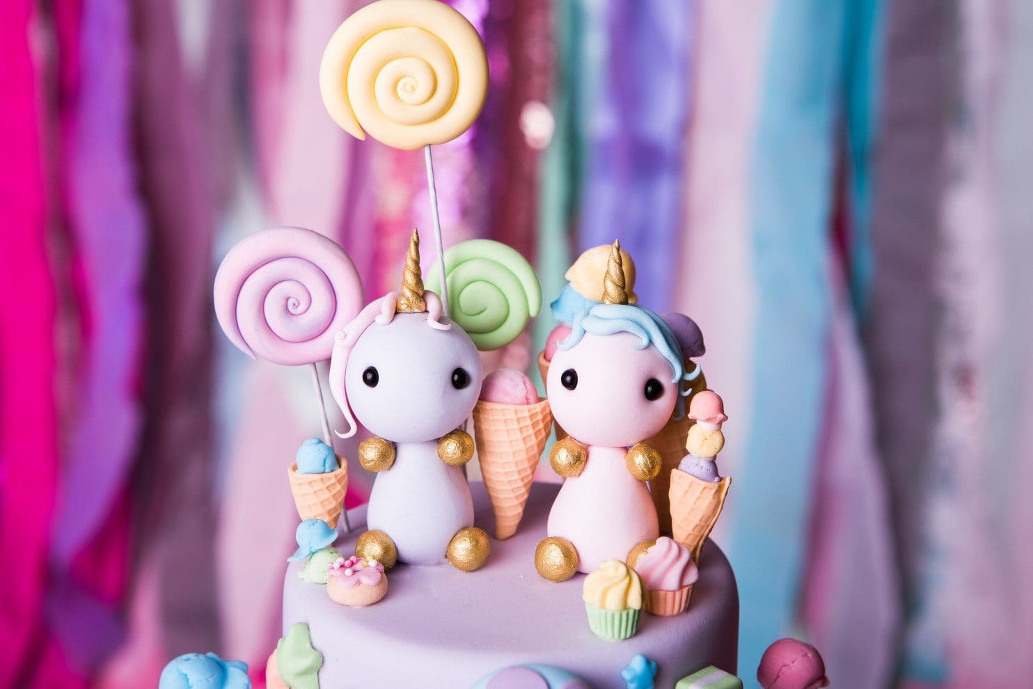 Vegan fondant cake toppers - two unicorns holding lollipops and ice creams