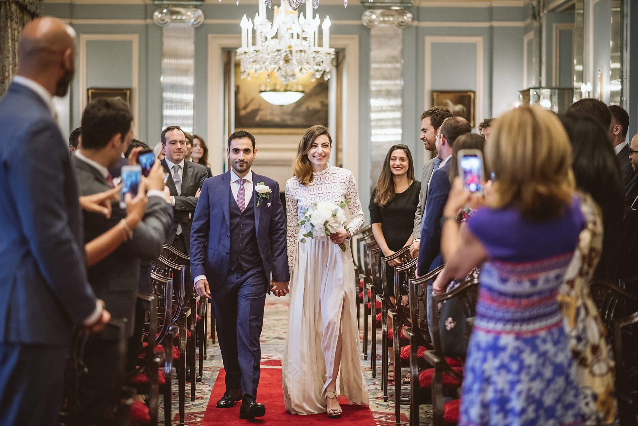 Bride and groom walk down the aisle at their Lanesborough Hotel Wedding Ceremony