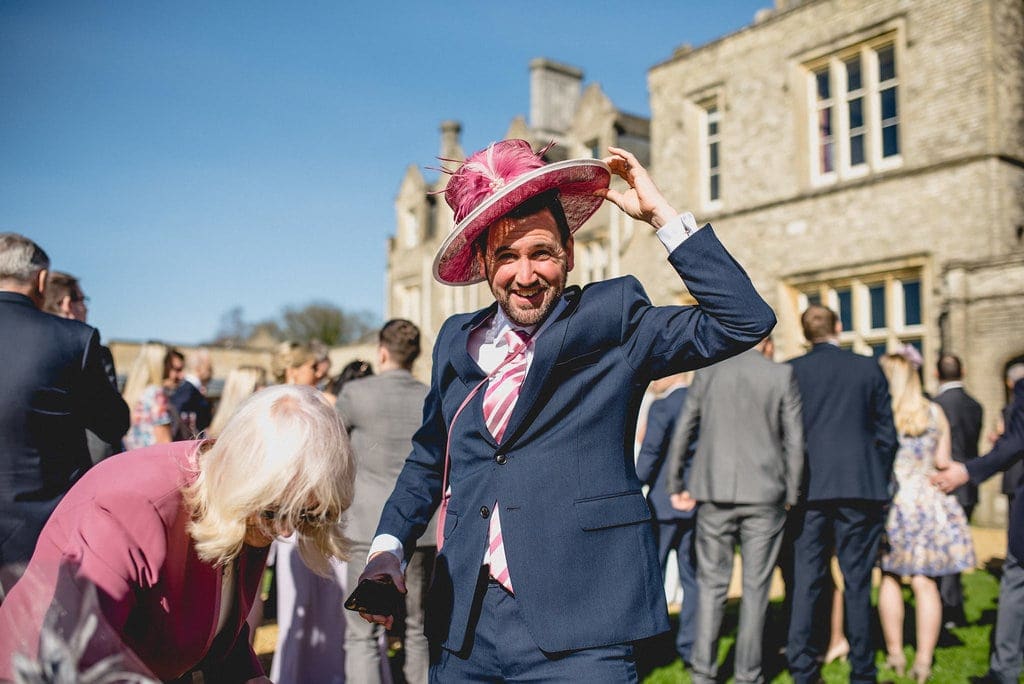 Male guest tries on pink hat