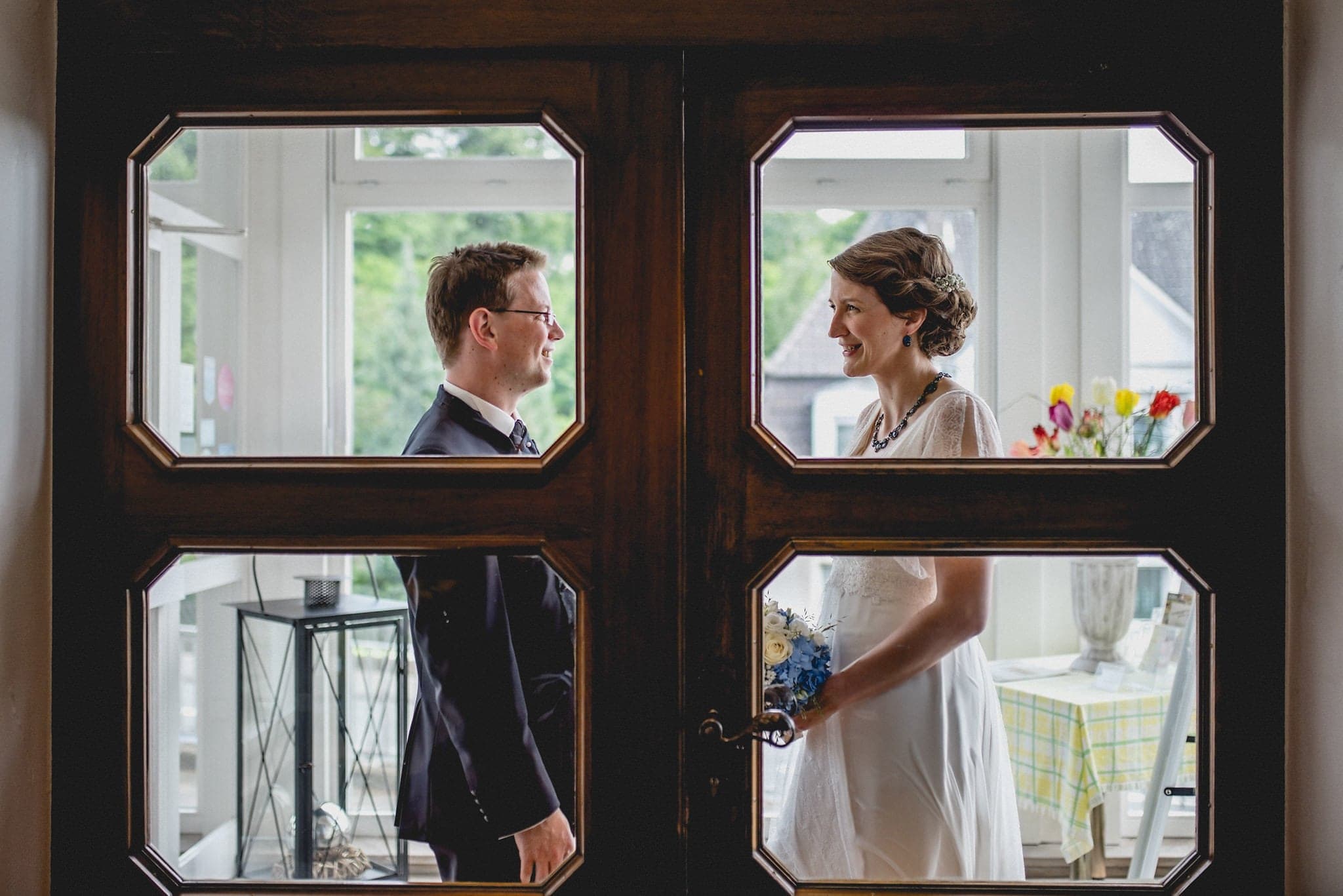 Bride and groom looking at each other before they enter their wedding reception