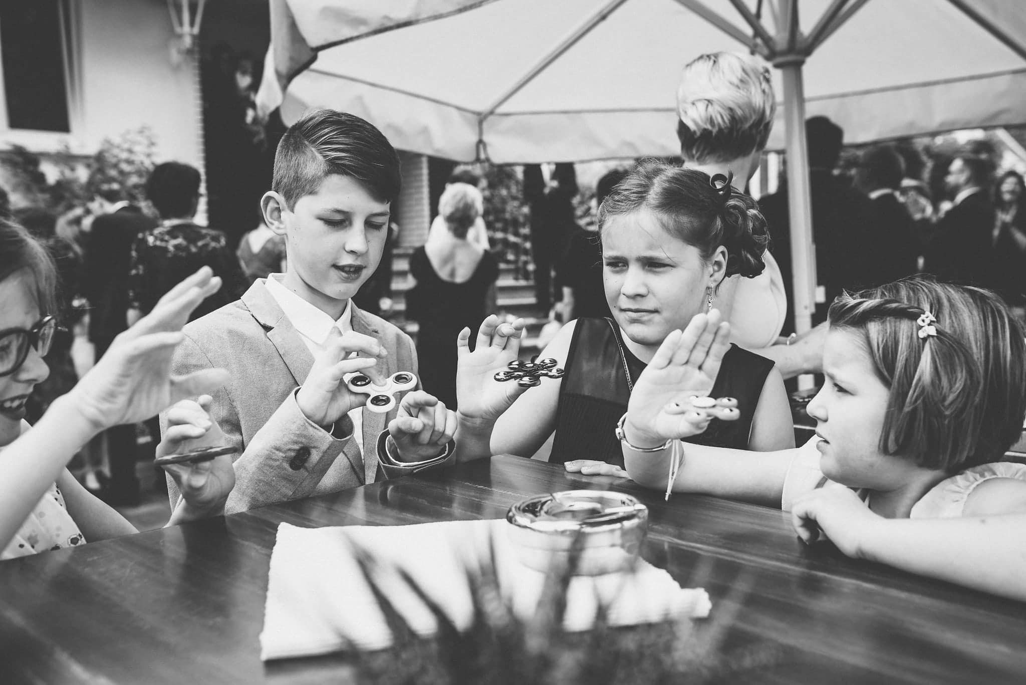 Kids spinning fidget spinners at a Heartfelt Destination Wedding in Germany | Maria Assia Photography