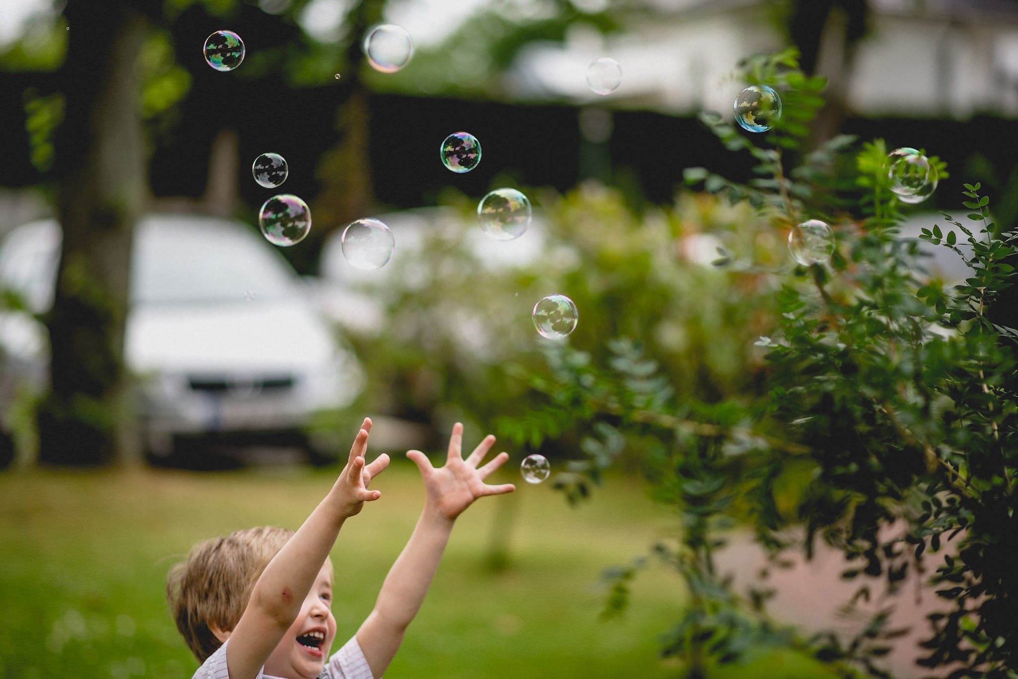 kid chasing bubbles