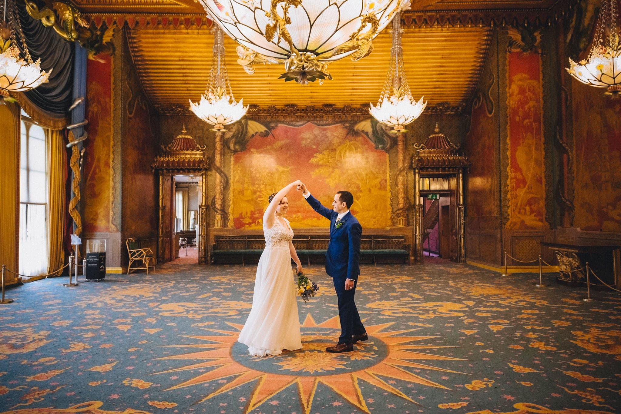 Groom twirls his bride in Royal Pavilion ballroom in Brighton